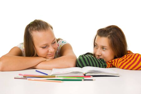 Two teenage girls  paint  isolated on whiteの写真素材