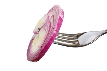 onions on a fork isolated on white backgroundの写真素材