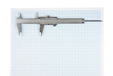 callipers on graph paper isolated on white backgroundの写真素材