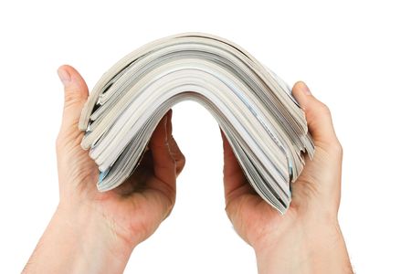 magazine in hand isolated on a white backgroundの写真素材