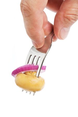 mushroom on a fork isolated on white backgroundの写真素材