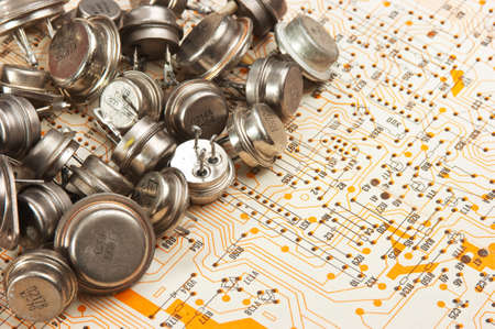 Old electronic components lie on the wiring diagramの写真素材