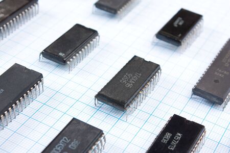 Old electronic components lie on the wiring diagramの写真素材