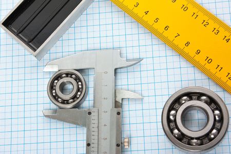 setsquare and calliper with bearing on graph paperの写真素材