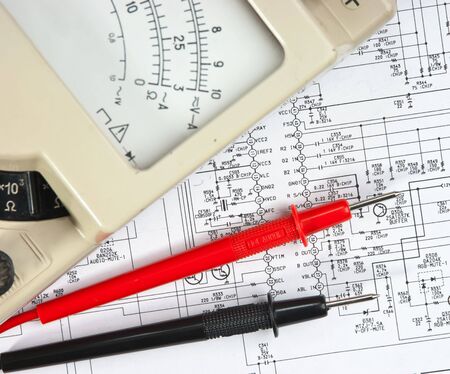 Old multimeter on the wiring diagramの写真素材