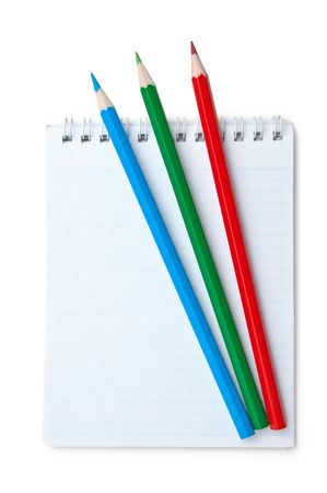 red  green blue pencils and notebook isolated on a white  backgroundの写真素材