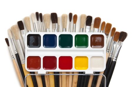 watercolor paints and  brushes isolated on a white  backgroundの写真素材