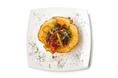 dishes of roast meat with vegetables and spices  isolated on white backgroundの写真素材