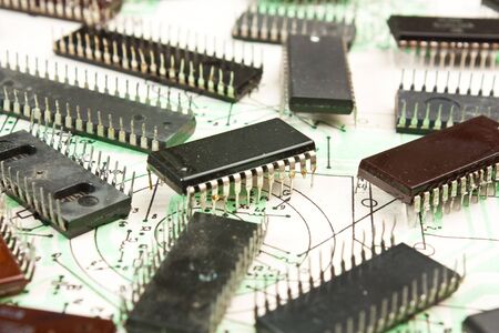 Old electronic components lie on the wiring diagramの写真素材