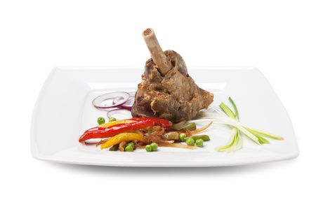 dishes of roast meat with vegetables and spices  isolated on white backgroundの写真素材