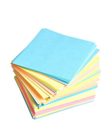 stack of colored paper isolated on white backgroundの写真素材