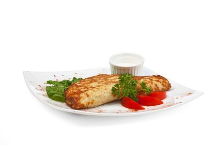 dish of pancakes with vegetables isolated on a white backgroundの写真素材