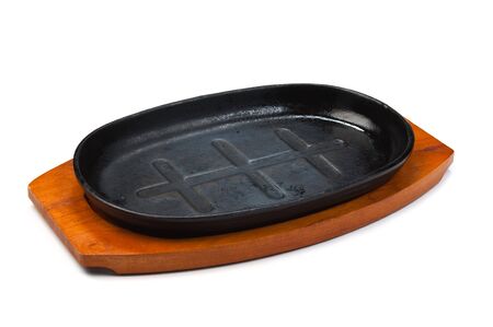 cast-iron pan isolated on white backgroundの写真素材