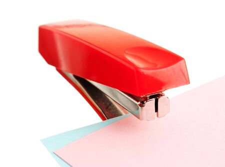 red stapler isolated on white backgroundの写真素材