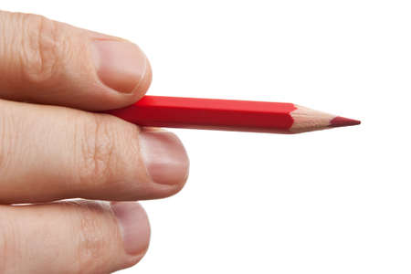 red pencil in hand  isolated on white backgroundの写真素材