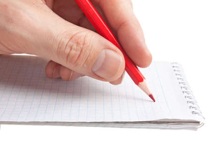 red pencil in hand  isolated on white backgroundの写真素材