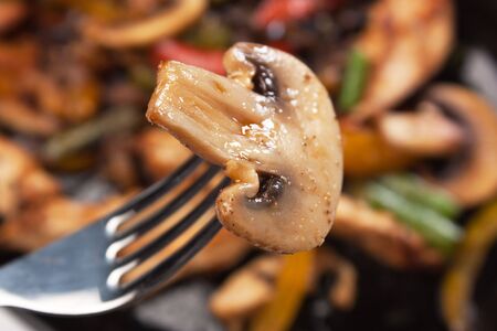 grilled mushroom on a forkの写真素材