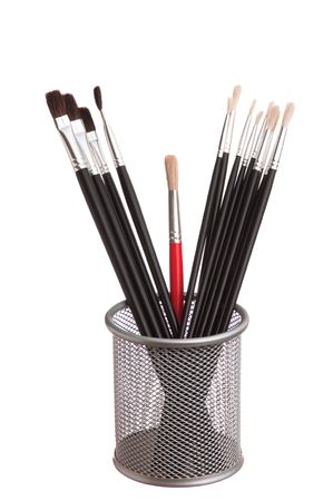 brush to paint in the basket  isolated on a white backgroundの写真素材