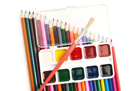 watercolor paints and colored pencils isolated on a white  backgroundの写真素材