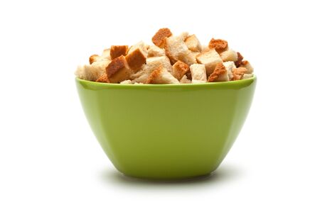 grain crackers in green bowl  isolated on white backgroundの写真素材