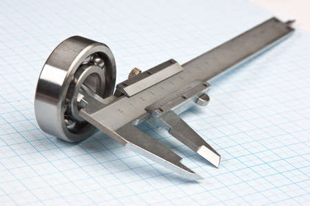 technical tools on a background of graph paperの写真素材