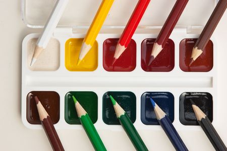 colored pencils and watercolor paintsの写真素材