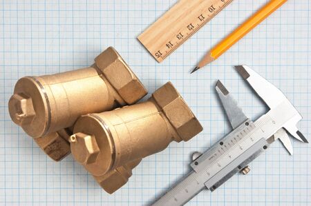 water inlet valve  on a background of graph paperの写真素材