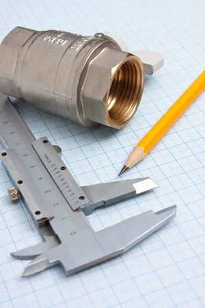water inlet valve  on a background of graph paperの写真素材