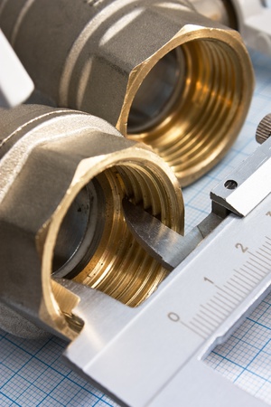 water inlet valve  on a background of graph paperの写真素材