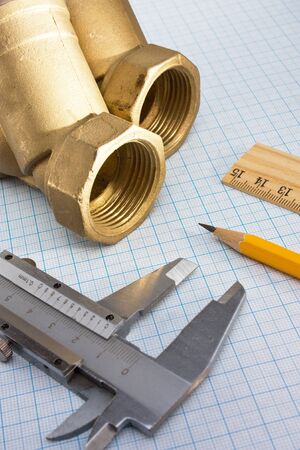 water inlet valve  on a background of graph paperの写真素材