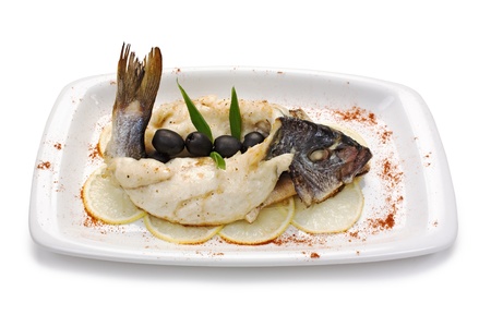 fish baked in pastry with olives  isolated on white backgroundの写真素材
