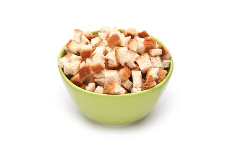 grain crackers in green bowl  isolated on white backgroundの写真素材