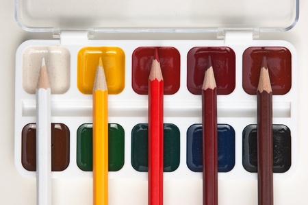 colored pencils and watercolor paints の写真素材
