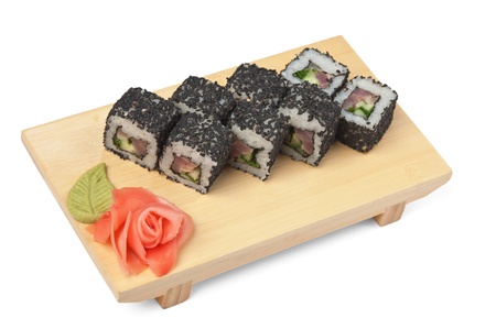 Traditional Asian food sushi on wooden plate isolated on white backgroundの写真素材
