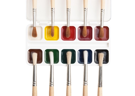 watercolor paints and  brushes isolated on a white  backgroundの写真素材