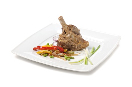 dishes of roast meat with vegetables and spices  isolated on white backgroundの写真素材