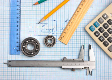 technical tools on a background of graph paperの写真素材