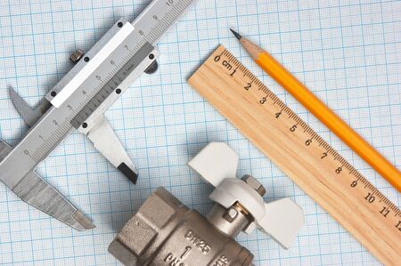 water inlet valve  on a background of graph paperの写真素材