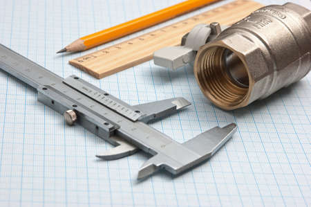 water inlet valve  on a background of graph paperの写真素材