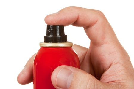 red spray bottle in his hand  isolated on a white  backgroundの写真素材