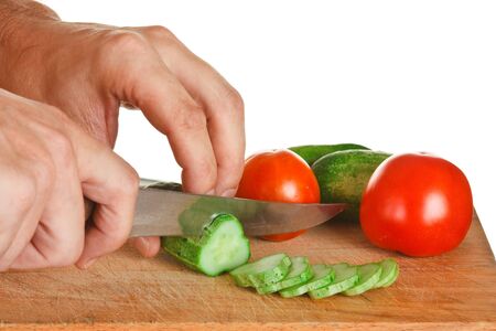 chop tomatoes and cucumbers  isolated  on white backgroundの写真素材