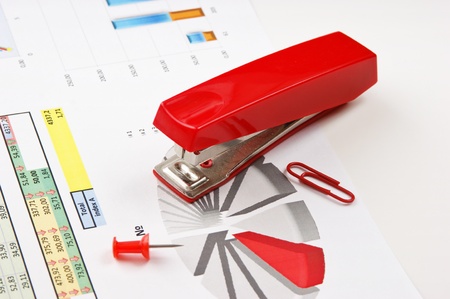 Stapler and working paper with a diagramの写真素材