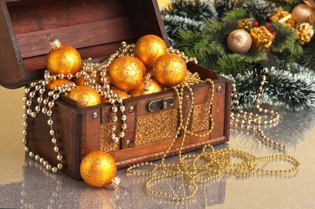 Christmas decoration in chest on Christmas background の写真素材