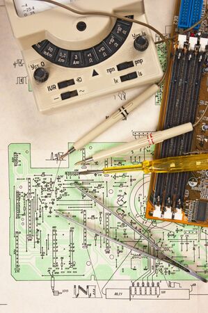 Old multimeter on the wiring diagramの写真素材
