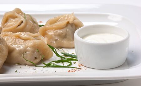 dish of ravioli with sour creamの写真素材