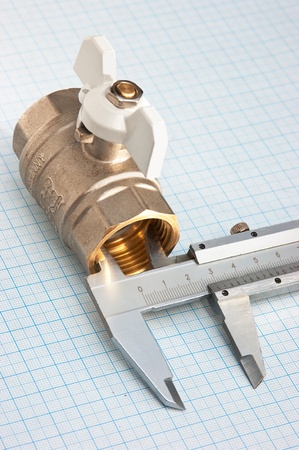 water inlet valve  on a background of graph paperの写真素材
