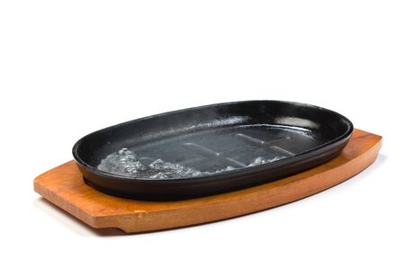 cast-iron pan isolated on white backgroundの写真素材
