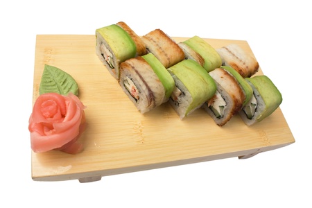 Traditional Asian food sushi on wooden plate isolated on white backgroundの写真素材