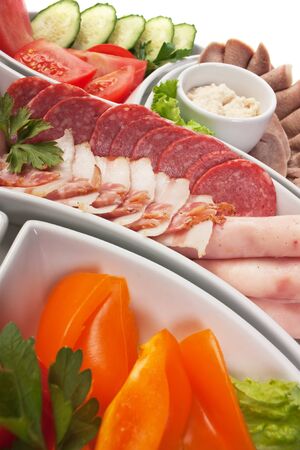 dish of assorted sausages and vegetablesの写真素材