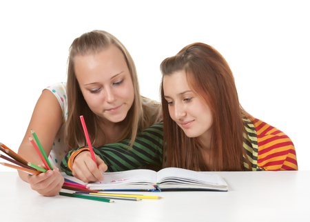 Two teenage girls  paint  isolated on whiteの写真素材